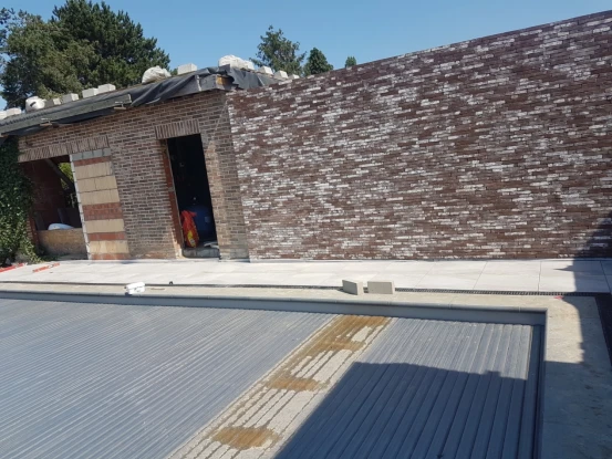 Muurstenen plaatsen Zelzate, Oost-Vlaanderen